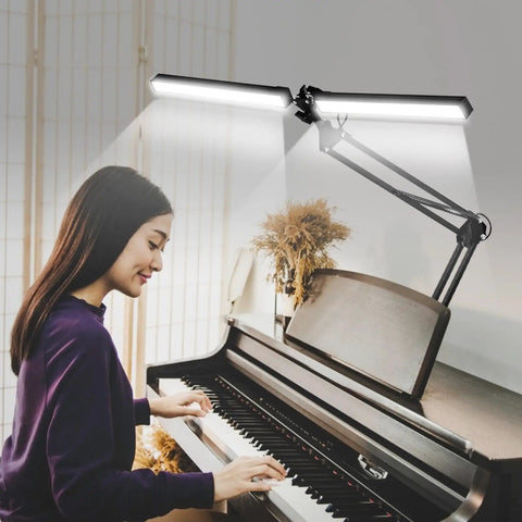 2 In 1 LED Desk Lamp With Clamp, 24W Ultra Bright Table Lamp illuminating a piano with a dual head design for home office setup