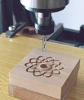 Upcut spiral router bit, 3-flute, 1/2 in shank, carving a flower pattern in wood