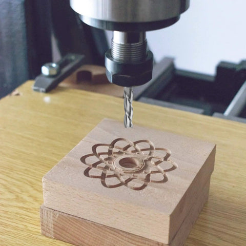 Upcut spiral router bit, 3-flute, 1/2 in shank, carving a flower pattern in wood