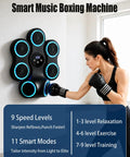 Woman using Wall Mounted Boxing Trainer With 3D Uppercut Targets, Smart Musical Boxing Machine For Stress Relief.