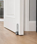 Durable Steel Construction Two Pack 1.5 Inch Anti Sag Door Support Wheels Low Profile Caster Hardware shown on a white door.