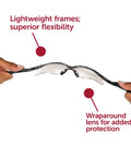 Hands flexing Nemesis Safety Glasses with Clear Anti Fog Lenses and Silver Frame Sporty Lightweight Design for All Day Comfort