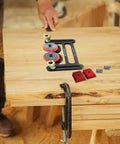 Killer Table Saw Featherboard With Rust Resistant Aluminum Body And Friction Free Bearing Rollers on wooden table.