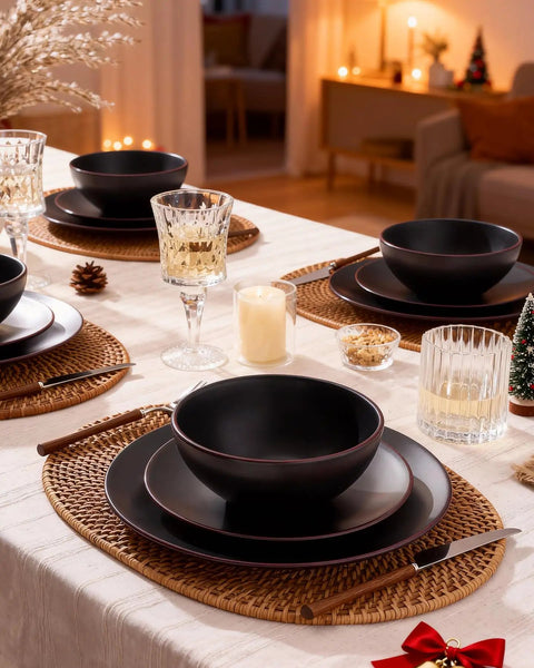 Venus 12 Piece Stoneware Plates And Bowls Set With Trim Chip Resistant Dinnerware For Four Matte Black displayed on dining table