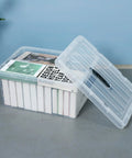 Clear stackable container showing papers, part of Two Pack 40 Gallon Heavy Duty Storage Bins With Smooth Rolling Wheels And Clinch Tight Lids.