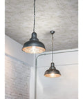 White Tin Tile Metallic Peel And Stick Wallpaper on ceiling with two industrial pendant lights in modern room
