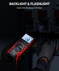 Person using True RMS 6000 Counts Auto Ranging Digital Multimeter with backlight, reading voltage on electrical panel in dark environment