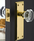 Crystal Door Knob With Plate In New York And Waldorf Style on a door, featuring a sleek clear knob and elegant brass back plate.