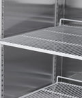 Interior view of Rock Solid Heavy Duty Commercial Refrigerator With Two Solid Doors 42 Cubic Feet Stainless Steel Upright Fridge shelves.