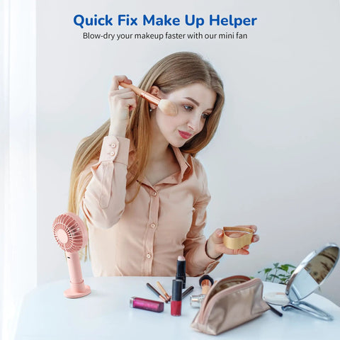 Woman using Handheld Portable Fan With 4000mAh Rechargeable Battery And 10 Hour Battery Life during makeup routine