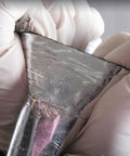 Close-up of Heavy Duty Black Asphalt Crack Repair Tape showing aluminum foil backing, ideal for sealing roofs and decks.