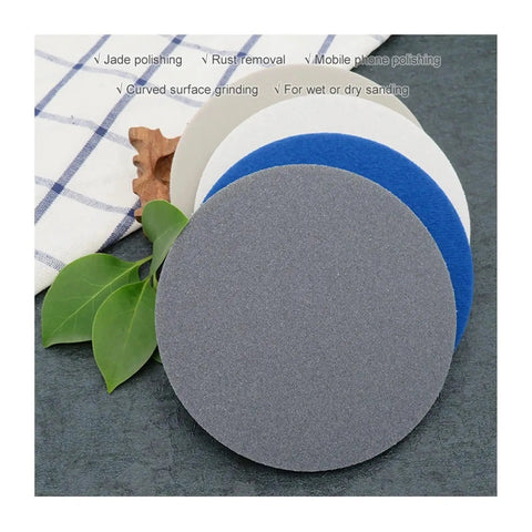 Six Pack 5 Inch Sponge Sanding Discs With Peel And Switch Backing For Easy Swap and Dust Vent Holes, gray disc shown.