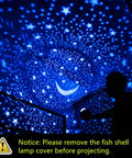 Epic Kids Star Projector Night Light with Three Color LED Bulbs projecting stars and moon on blue ceiling with silhouette child