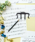 Heavy Duty Metal Music Book Clips For Piano Sheet Music Holder Black Gentle On Pages Universal Fit For Scores Books Or Notebooks Your Must Have Go To Clip Set To Keep Pages Open And Secure During Practice Or Performance. Black metal sheet music clip holding piano scores open