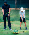 Father and son practicing with Adjustable Golf Putter For All Ages With A Two Way Right And Left Handed Design Kid Friendly Mini Golf Set
