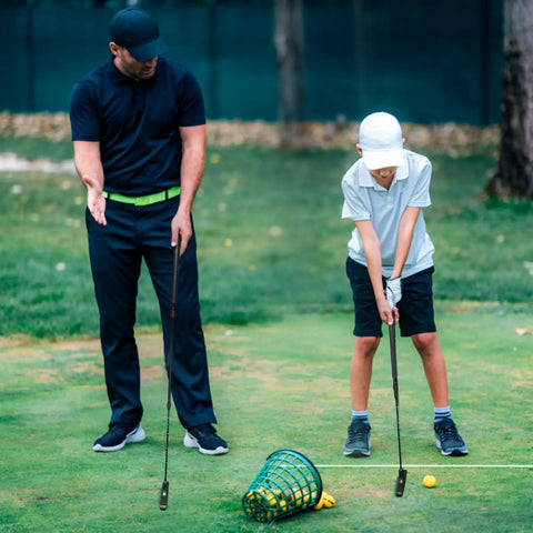 Father and son practicing with Adjustable Golf Putter For All Ages With A Two Way Right And Left Handed Design Kid Friendly Mini Golf Set