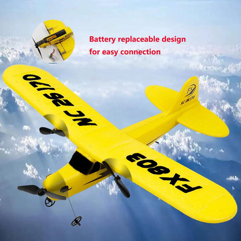Yellow 2.4GHz 2CH RC Airplane Glider with 340mm wingspan flying above clouds, showing battery replacement feature.