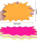 Eye Catching Burst Star Neon Signs Set, 60 Piece Pack in Six Fluorescent Colors for Retail Displays, shown in hand, 5x6.6 inches