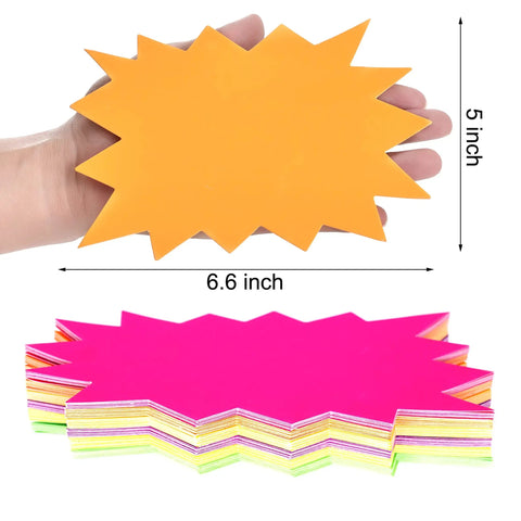 Eye Catching Burst Star Neon Signs Set, 60 Piece Pack in Six Fluorescent Colors for Retail Displays, shown in hand, 5x6.6 inches