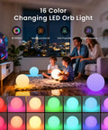 Family enjoying 8 Inch LED Night Light Ball With Remote, 16 RGB Colors, Dimmable Globe, Rechargeable Floating Pool Light indoors