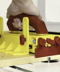 Close-up of push block for table saws with hand grip, part of Wood Organizer And Lumber Storage Metal Rack With Six Level Wall Mount