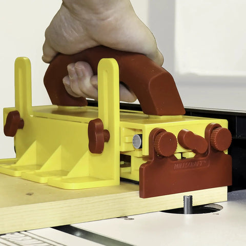 Close-up of push block for table saws with hand grip, part of Wood Organizer And Lumber Storage Metal Rack With Six Level Wall Mount