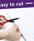 Cutting Energy Saving Window Air Conditioner Foam Insulation Panels 2 Pack Side Panel Kit Seals Gaps For Summer And Winter Heat Draft Protection White 17 Inch High By 9 Inch Wide By 7/8 Inch Thick with scissors showing ease of trim feature.