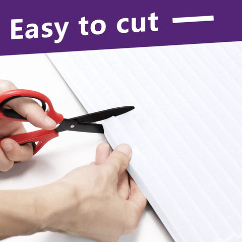 Cutting Energy Saving Window Air Conditioner Foam Insulation Panels 2 Pack Side Panel Kit Seals Gaps For Summer And Winter Heat Draft Protection White 17 Inch High By 9 Inch Wide By 7/8 Inch Thick with scissors showing ease of trim feature.