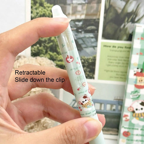 Close-up of a Four Piece Erasable Gel Pens With Retractable Cat Cartoons 0.5mm Black Ink Green Cat Pattern being held.