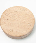 Bottom view of the Wooden Thread Cutter Blade For Sewing With Daisy Flower Design, showing non-slip silicone feet for stability.