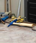 Chipping Welding Hammer 12 Ounce Made in USA With Drop Forged High Carbon Steel And Chisel Style Faces on workbench