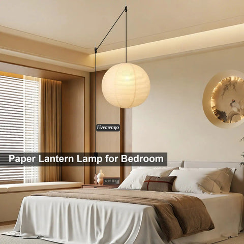 Twenty Inch Off White Japanese Rice Paper Lantern Plug In Pendant Light With Adjustable Cord Sets in a cozy bedroom setting.