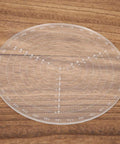 Front view of a transparent acrylic 7.87-inch center finder compass with concentric circles and degree marks.