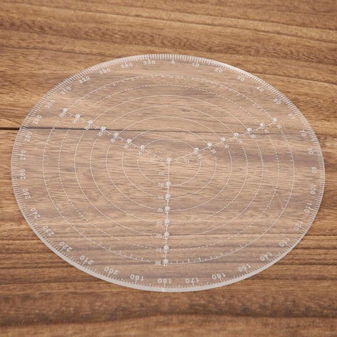 Front view of a transparent acrylic 7.87-inch center finder compass with concentric circles and degree marks.