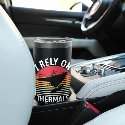 Hang Gliding Themed Stainless Steel Insulated Tumbler on car console, black with hang glider graphic and text. Perfect for enthusiasts.