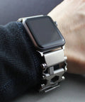 Person wearing Stainless Steel Watch Adapter For Leatherman Bracelet Silver Tread Compatible With Apple Watch Ultra.