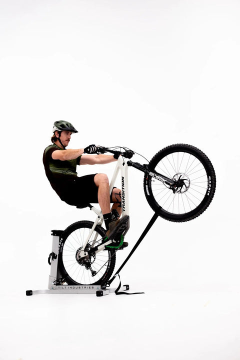 Cyclist on Bike Balance Trainer And Repair Stand Combo for Core Stability and Quick Reaction Time training indoors