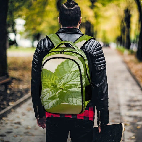 Man wearing Green Mint Herb Printed Unisex Backpack With Large Capacity, Casual Daypack For School, Work And Travel, outdoor setting