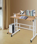 Effortless Folding Standing Desk With Smooth Rolling Casters And Tilted Writing Panels For Total Flex Work From Home Setup Featuring Quick Height Adjustments In Modern Light Walnut And White, showcasing a compact design with books and decor.