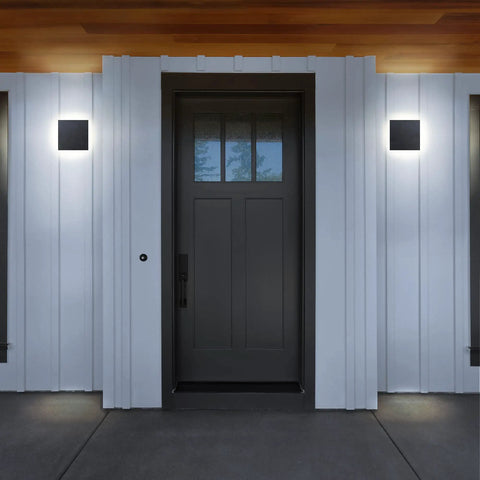 Edge LED Wall Light Indoor Outdoor Black Modern Sconce, Waterproof IP65, flanking a front door on white paneling.