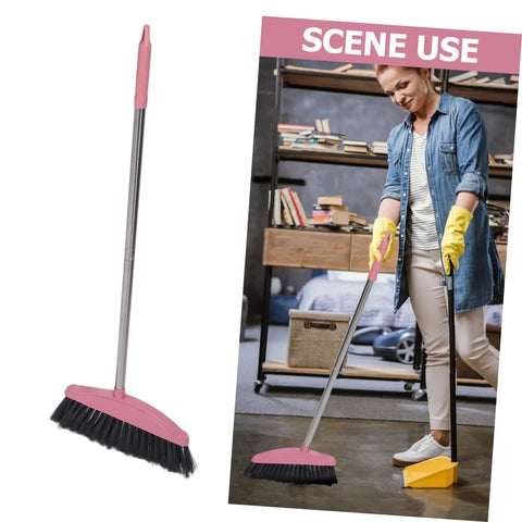 Heavy Duty Pink Broom With Extended Handle Sweeps Indoors And Outdoors, used for cleaning floors in a home setting.