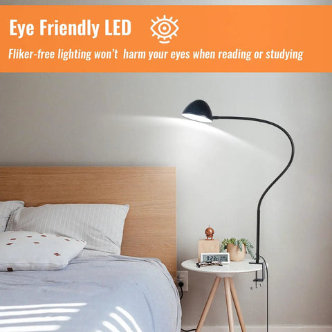 Gooseneck Clip Desk Lamp With Clamp, 10W 1100 Lumens, 31 Inch Flexible Arm, USB Powered next to a bed and nightstand.