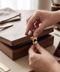 Person installing a latch on a wooden jewelry box using Bulk 100 Set Iron Toggle Hasp Latches With Screws For Jewelry Boxes Wood Cabinets And Storage Projects Yellow Heavy Duty Hardware Upgrade.