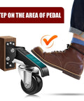 Foot pressing the pedal of Heavy Duty Retractable Caster Wheels For Workbenches 700 Lb Capacity 4 Pack