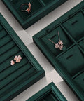 Top Tier PU Leather Jewelry Display Tray Featuring Twenty Four Secure Grid Slots For Rings Earrings And Brooches with floral jewelry.