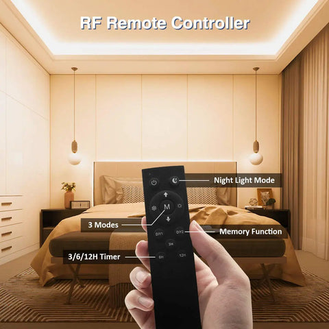 Hand holding remote for Lit 82ft Dimmable 24V White LED Strip Lights in bedroom, showing timer and modes.