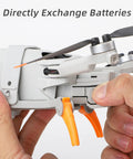 30cm Height Landing Gear For Mini 4 Pro Drone Lightweight Orange Quick Release Height Extender being attached.