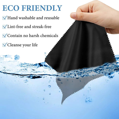Black microfiber glasses cleaning cloth held by hand over water splash front view