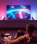 Touch Lamp Multicolor Night Light For Kids illuminating soft ambient lighting while a couple watches TV.