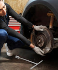 A person using a Straight Shooter T Handle Socket Wrench Set Forged From Heavy Duty Steel To Crack Open Stubborn Nuts And Bolts Without Breaking A Sweat on a car wheel.